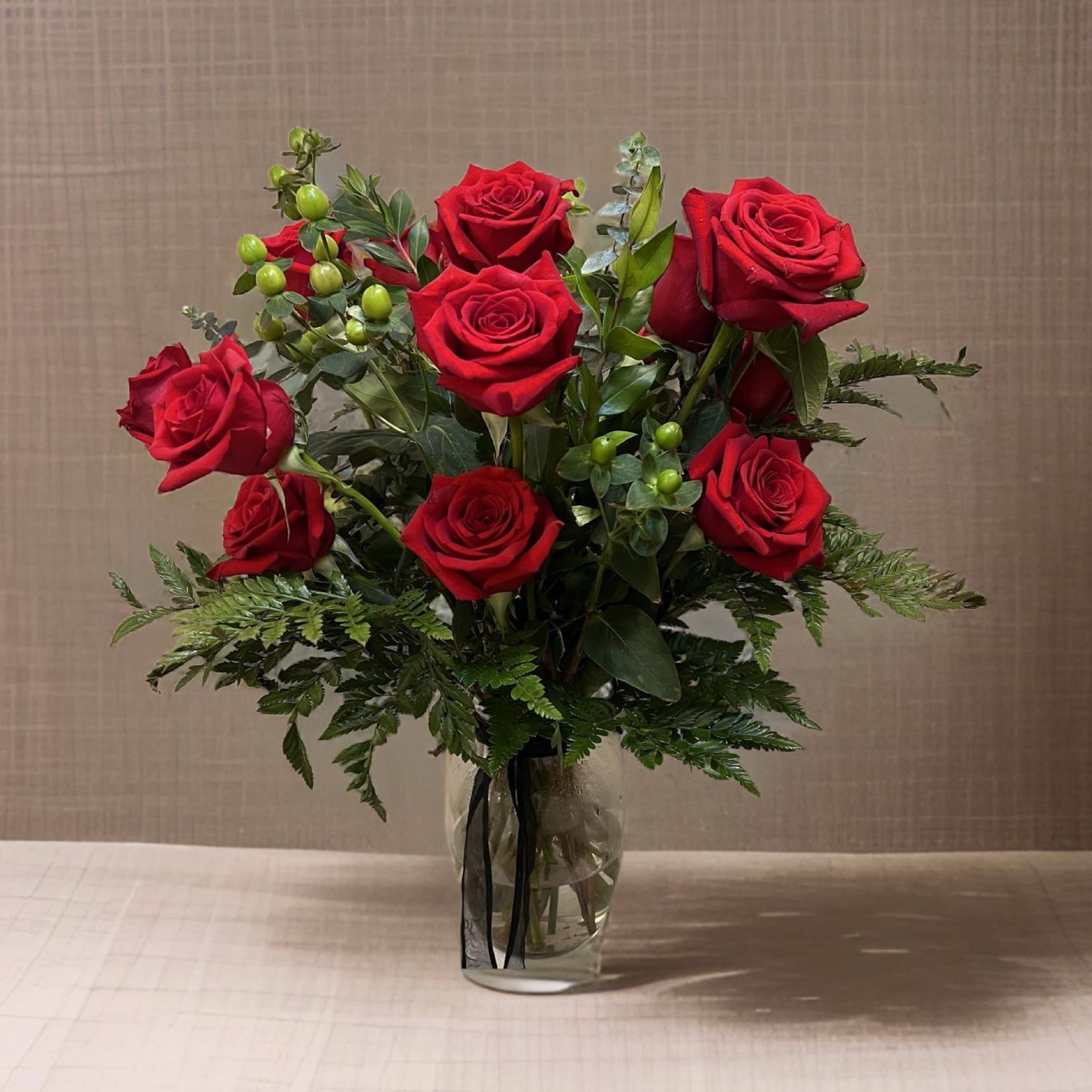 Classy - These dozen red roses are the classic romantic gift! Perfect for Valentine's Day or an Anniversary.   APPROXIMATE DIMENSIONS: 25&quot; H X 18&quot; W