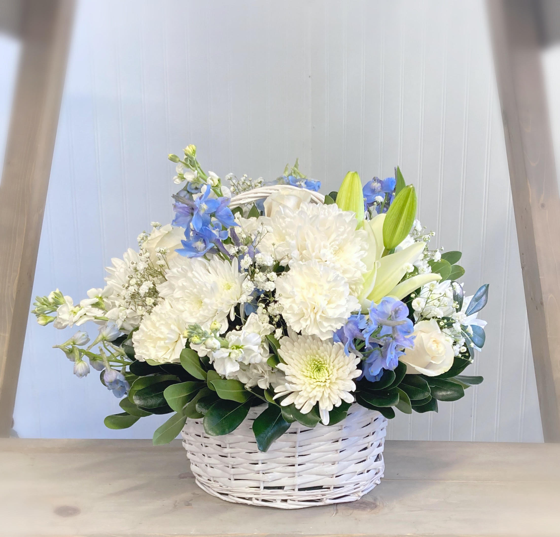 Tender Sympathy - Blue and White - Our peaceful blue and white design is hand crafted in a wicker basket