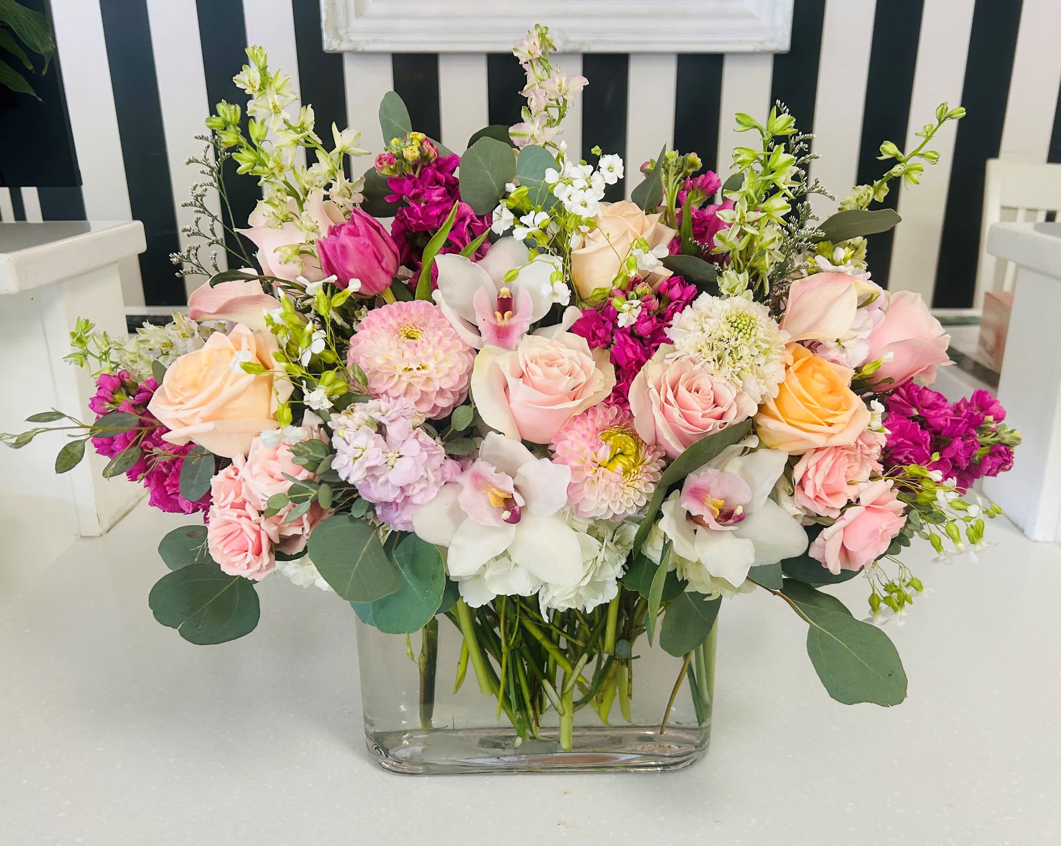 Garden of Love - This beautiful arrangement is filled with premium blooms with a color palate of, light pinks, medium pinks, peach, whites and creams. 