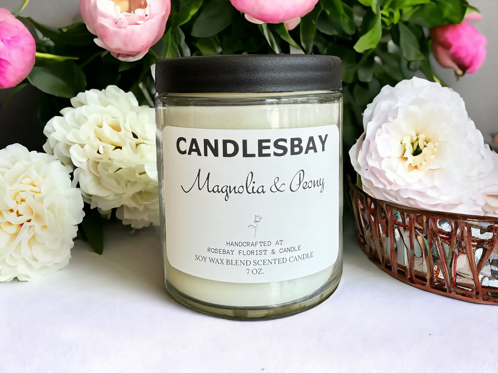 Magnolia & Peony SOY BLEND CANDLESBAY Magnolia & Peony SOY BLEND CANDLESBAY - A handcrafted scented soy blend candle at our store. The candle is 7 oz, cotton wick.