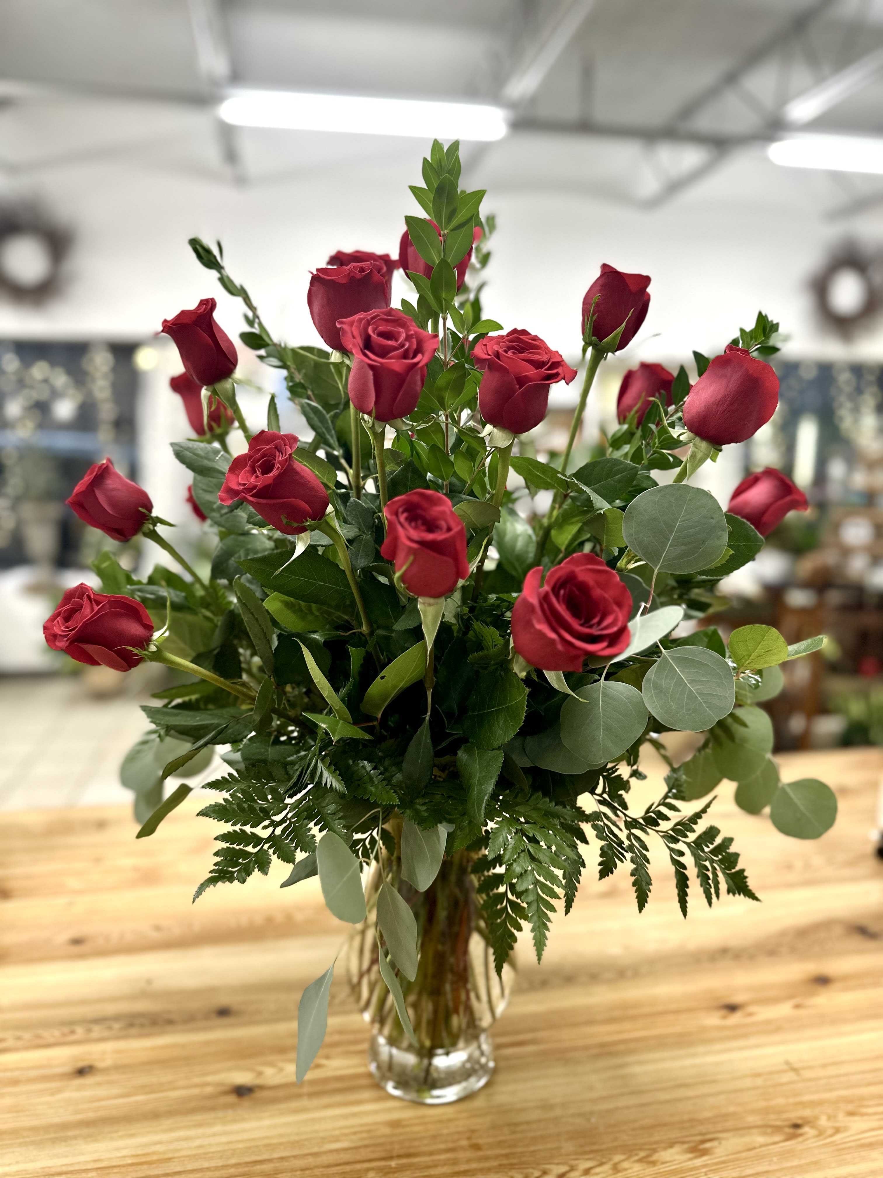 Two Dozen Long Stemmed Roses vase arrangement by Westford Florist - Wow your loved one with this stunning Two Dozen Long Stemmed Roses vase arrangement by Westford Florist! Bursting with romance and elegance, these bold red roses are sure to make a statement and leave a lasting impression. Perfect for any occasion, from birthdays to anniversaries or just because you want to show someone how much they mean to you. Say it with flowers by Westford Florist and let the beauty of these blooms do all the talking. Order yours today and watch love blossom before your eyes! APPROXIMATE DIMENSIONS: 30&quot; H X 22&quot; W