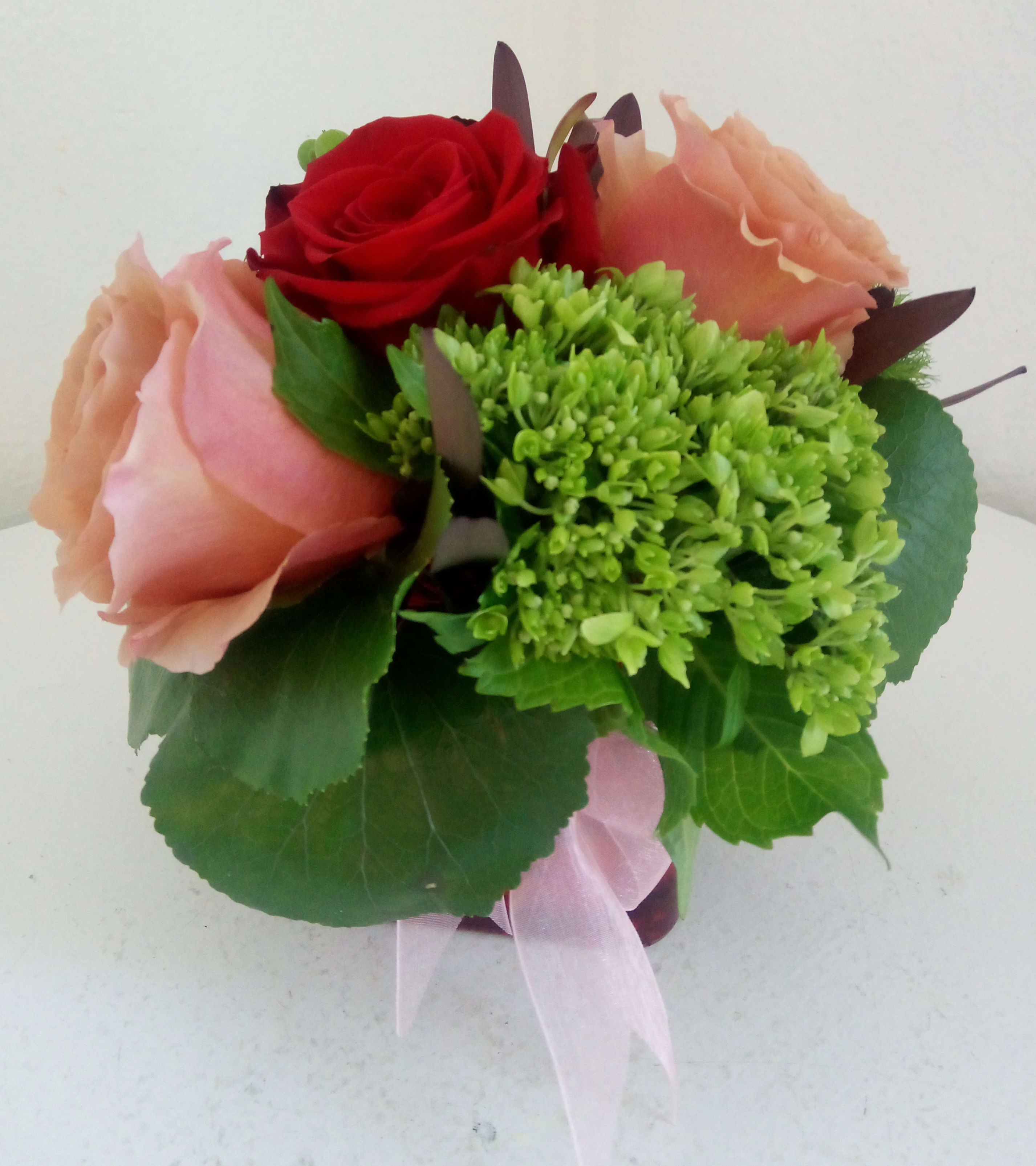 My Precious - Red and pink roses with green hydrangea in a glass cube