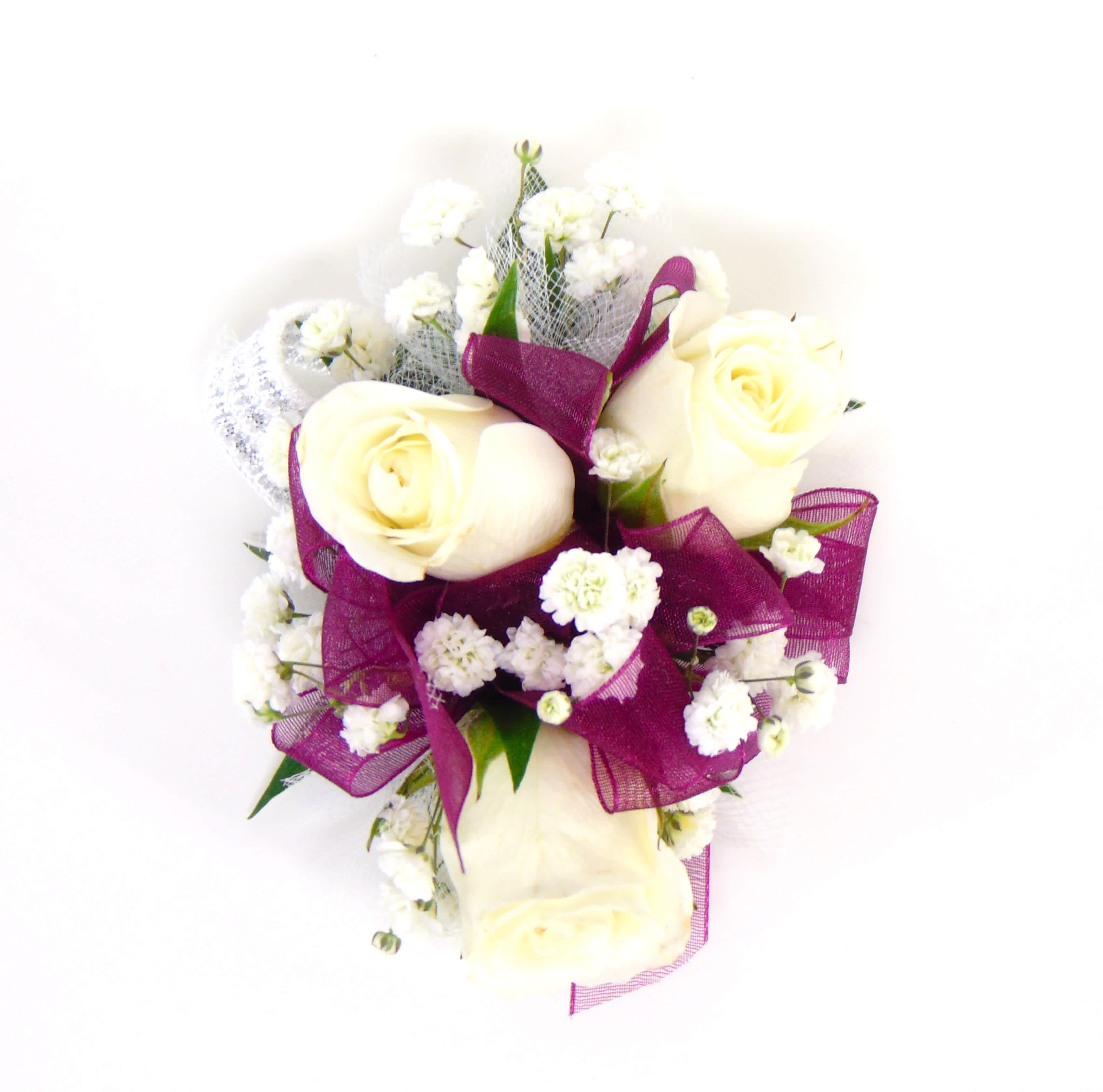 White Spray Rose Wrist Corsage with Plum Accents -  Three white spray roses, plum ribbonaby's breath, greens, white tulle on a standard wristlet. $39.99  Deluxe option adds bling. Premium option includes bling and  adds a beaded wristlet.  Includes corsage box. 