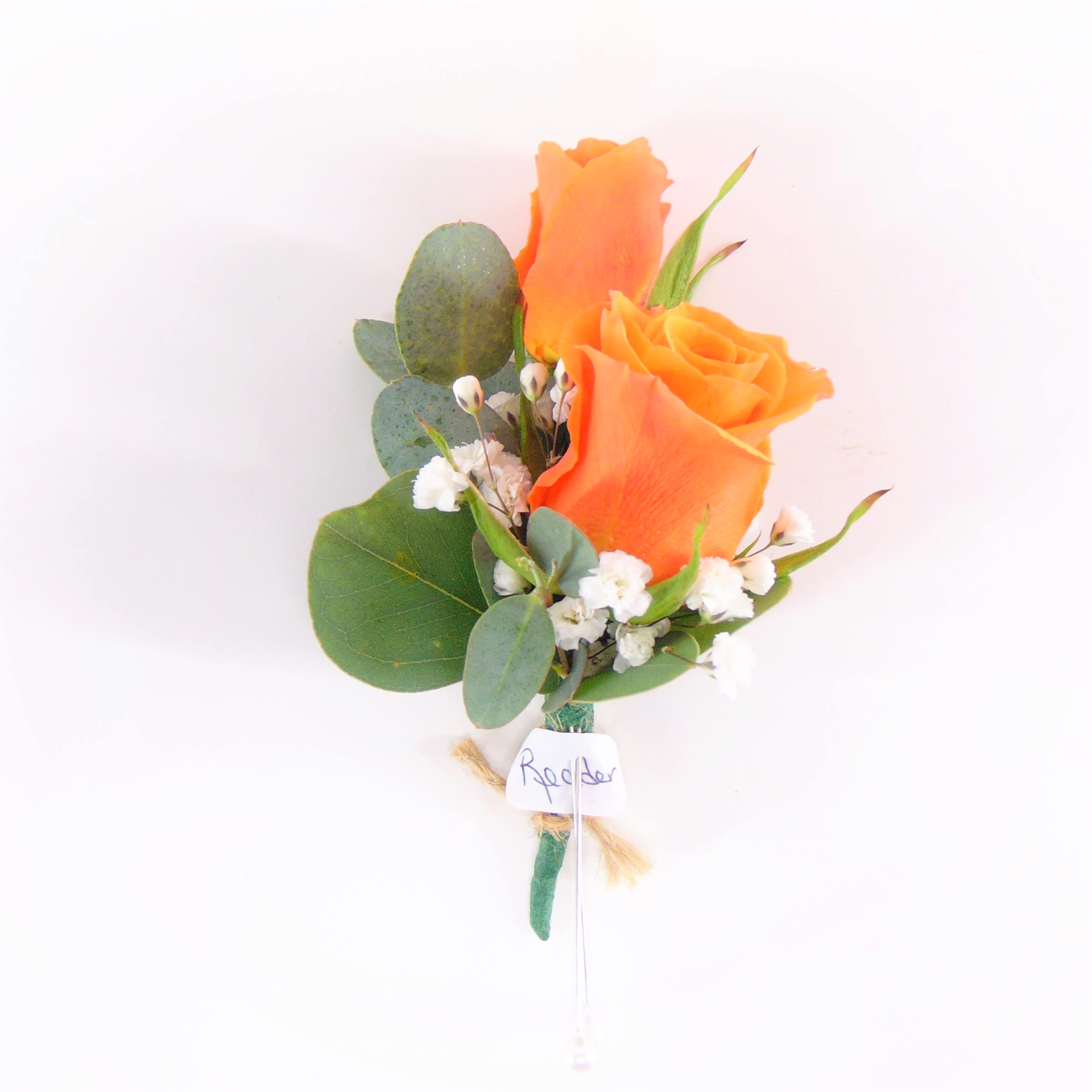 Two Orange Spray Rose Boutonniere - Two orange spray rose boutonniere, eucalyptus, white accents, standard green stem wrap. Standard option is pictured. Deluxe option adds bling. Includes boutonniere box.