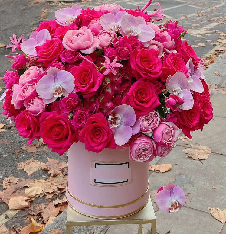 elegance &amp; beauty arrangement - Indulge in the opulence of a captivating blend of roses, orchids, and more. This floral masterpiece is more than just a box of flowers; it's a celebration of love in every shade of pink. This arrangement is a symbol of elegance and affection