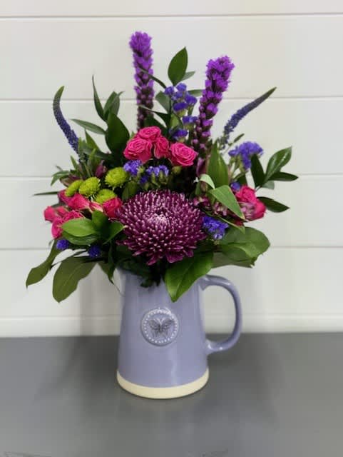 Sweet Mama Bouquet - Sweet pinks and lavenders/purples arranged in a lavender keepsake container.  Flowers and colors may vary depending on availability. 