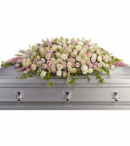 T236-3A - Always Adored Casket Spray - A beautiful spray of soft pink white and cr?me blooms ease the burden of loss. Pink hydrangea larkspur and roses mingle with white roses stock and waxflower. Ivy fern and fragrant eucalyptus act as green accents in this spray that rests atop the casket.Approximately 66&quot; W x 28&quot; H Orientation: N/A As Shown : T236-3A