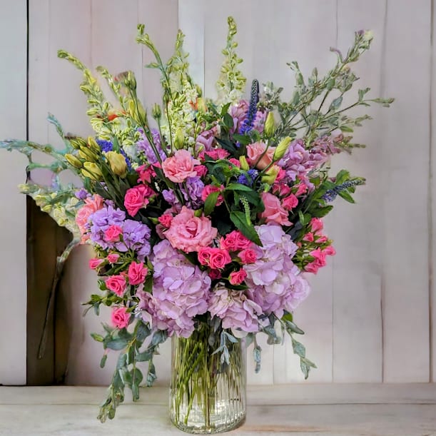 Spring Breeze by Parisian Florist - Spring has sprung!  These beautiful pink, lavender and white flowers are light and breezy and will make the recipient feel wonderful!