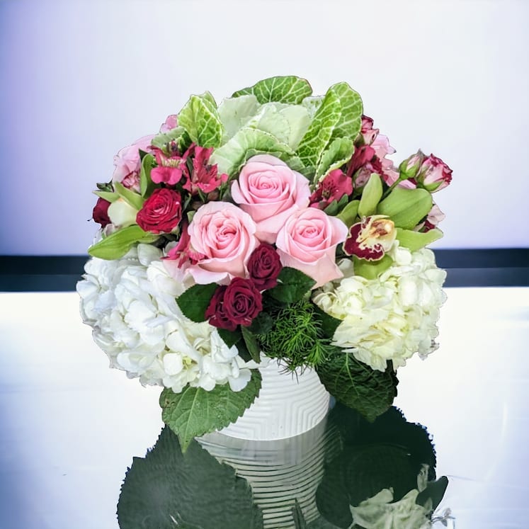 My One True Love by Parisian Florist - Pink, red and white, what is more romantic. 9 pink roses, spray roses and cymbidium orchids nestled in lovey soft hydrangea.