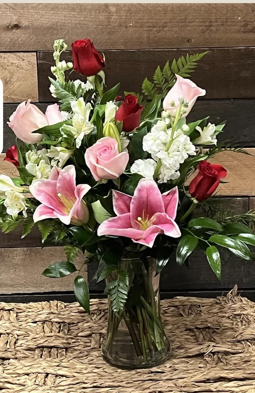 Rose Blush Bouquet Rose Blush Bouquet - Red roses and pink lilies mingle with stock, alstroemeria, and carnations, accented by lush greenery