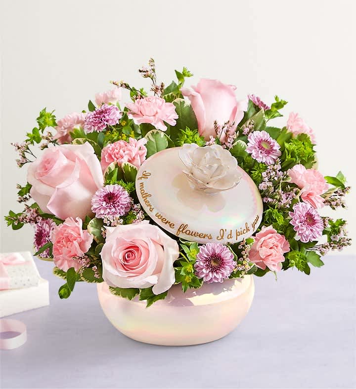  Mother’s Love arrengement - Our local florists put love into every arrangement. Sometimes they have to substitute flower types, colors &amp; containers to give you the freshest blooms available. Although your bouquet may vary from the photo shown, we promise your recipient will love it just as much!