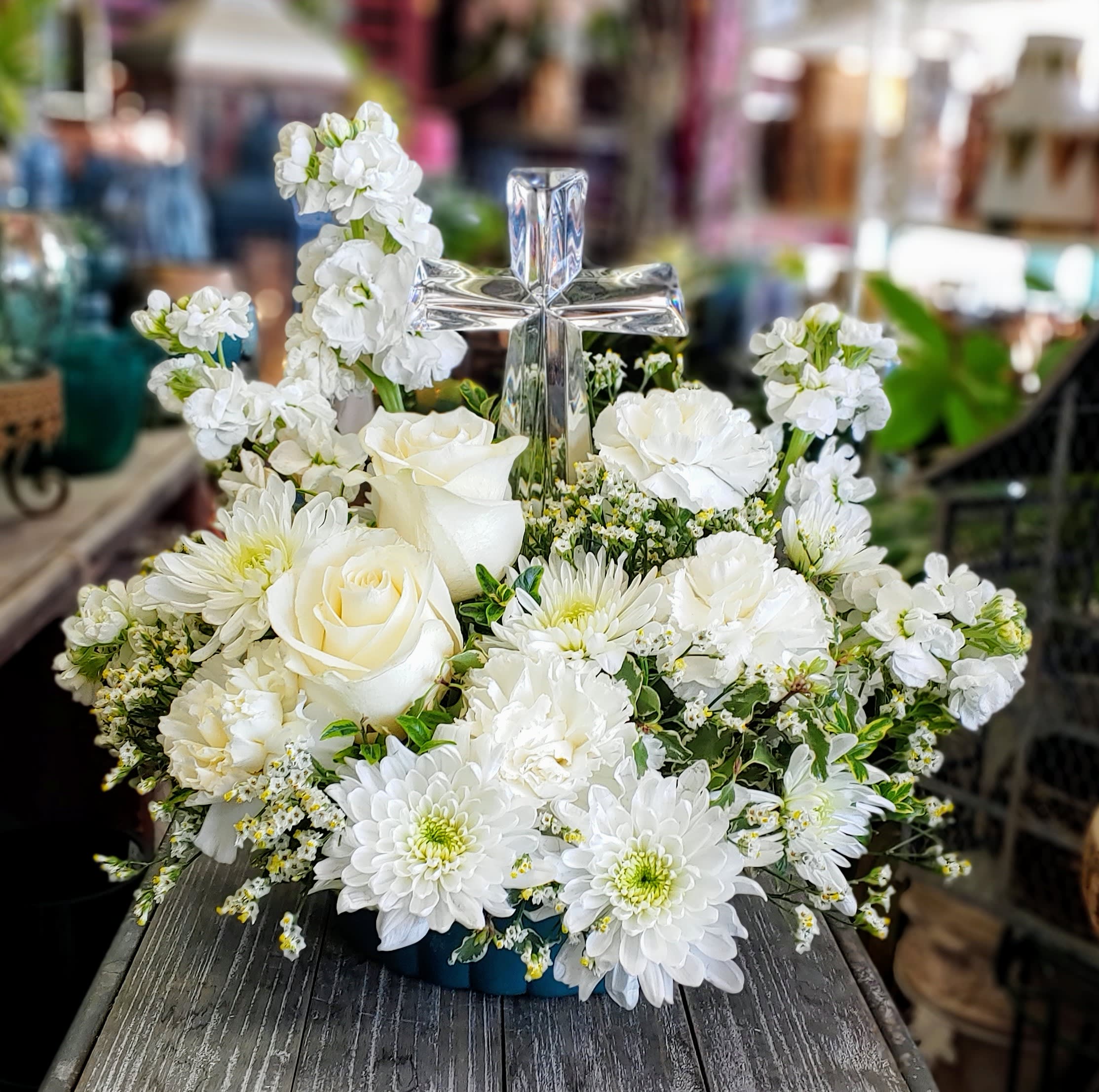 Crystal Cross - An all white arrangement with a keepsake crystal cross. An ideal arrangement for either the home or service.