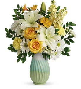 Teleflora's Art Of Spring Bouquet Teleflora's Art Of Spring Bouquet - Nothing says spring like this artistic gift, pairing a sunny yellow bouquet with the fresh greens of this hand-glazed, glossy stoneware vase.  This colorful mix features yellow roses, white asiatic lilies, yellow alstroemeria, light yellow carnations, light yellow stock, white daisy spray chrysanthemums, white sinuata statice, and huckleberry. Delivered in an Art of Spring vase.  Approximately 15 1/2" W x 18 1/2" H
