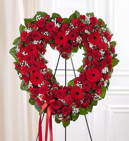 Red Open Heart FH6 Red Open Heart FH6 - All-red open heart-shaped arrangement of roses, spray roses, Gerbera daisies, carnations, mini carnations, hypericum; accented with baby’s breath and soft, lush greenery