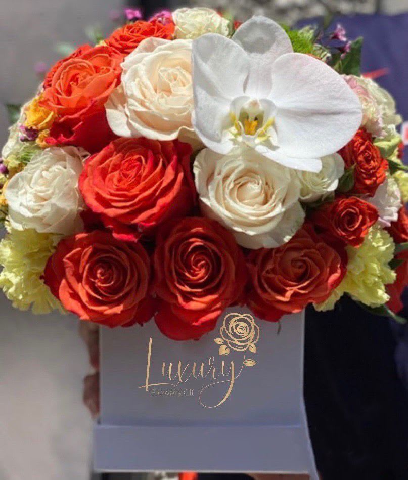 Ava Box - Luxurious floral arrangements with 100% real and fresh flowers make this arrangement a true symbol of luxury for any occasion. All Occasion Color Box: White or Black (subject to inventory availability) Place your Order Online Monday to Saturday before 1:00 p.m. (E.T.) for same-day delivery.  “Orders received after hours will be delivered the next business day”. Check our coverage area. Occasionally, substitutions of flowers and/or containers happen due to weather, seasonality, and market conditions which may affect availability. If this is the case with the gift you’ve selected, we will ensure that the style, theme, and color scheme of your arrangement are preserved and will only substitute items of equal value or higher value.  CARE INSTRUCTIONS Gently mist the arrangement with natural water every other day. Do not spray any cleaning product on the flower arrangement. Do not place heavy objects directly on the flower arrangement. Keep them out of direct sunlight and extreme heat. 