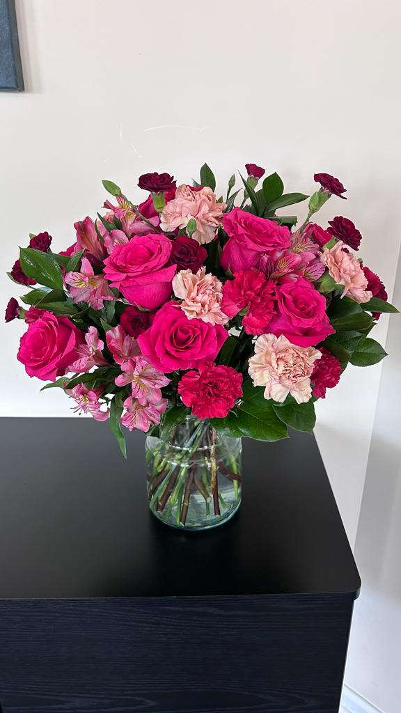 Precious Bouquet - Blushing shades of pink blooms are nestled in lush greens to charm anyone’s day. This bouquet is abundant with a classic assortment of pretty florals – roses, alstroemeria, and carnations to name a few. All Occasion Glass Pot •	Place your Order Online Monday to Saturday before 1:00 p.m. (E.T.) for same-day delivery.  •	“Orders received after hours will be delivered the next business day”. •	Check our coverage area. •	Occasionally, substitutions of flowers and/or containers happen due to weather, seasonality, and market conditions which may affect availability. If this is the case with the gift you’ve selected, we will ensure that the style, theme, and color scheme of your arrangement are preserved and will only substitute items of equal value or higher value.  CARE INSTRUCTIONS	 Keep the flower arrangement hydrated with natural water and change the water every two days. Do not spray any cleaning product on the flower arrangement. Do not place heavy objects directly on the flower arrangement. Keep flower arrangements out of direct sunlight and extreme heat.  