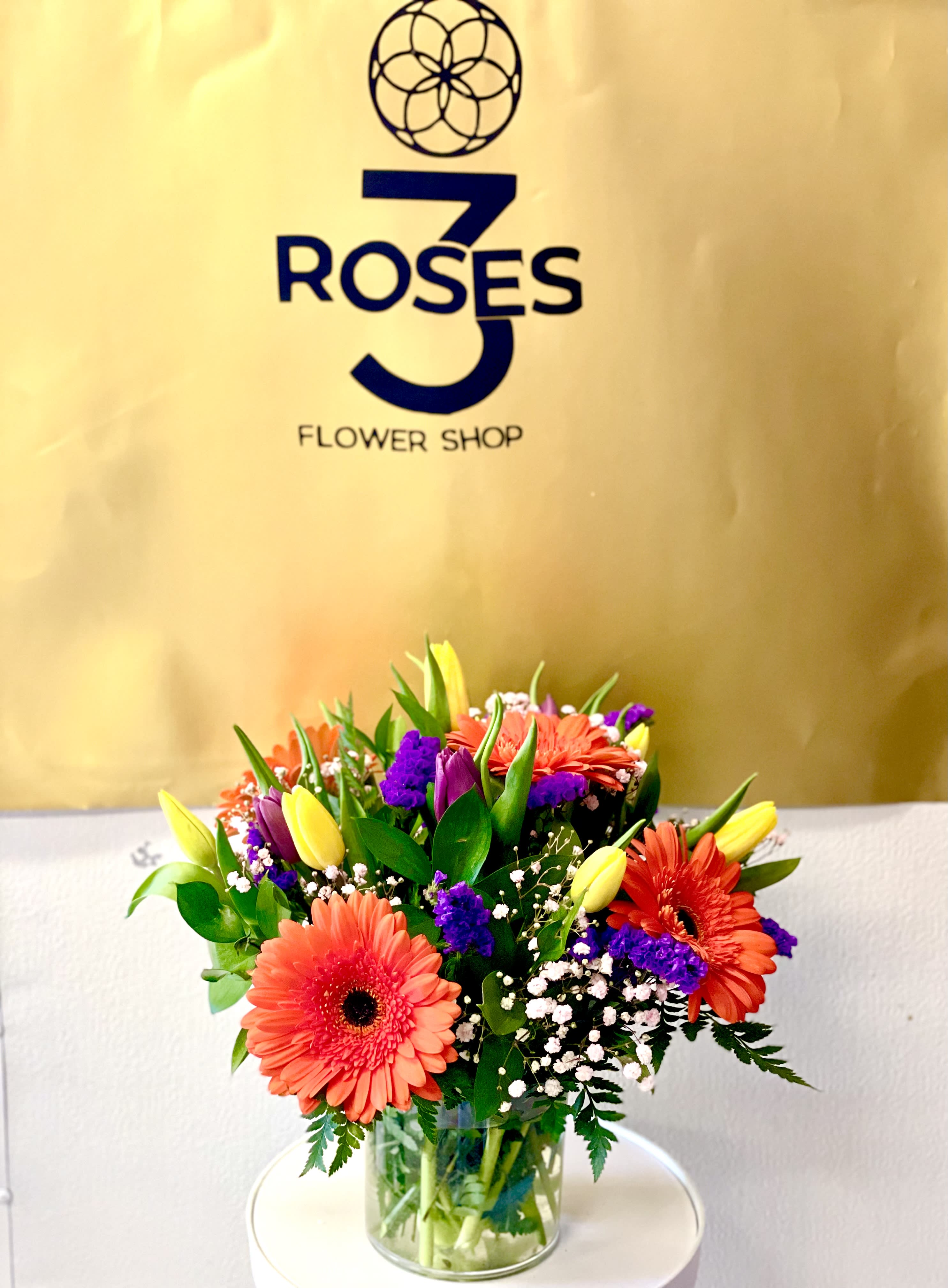 Spring time - Featuring gerberas daisies, tulips, and stock this petite arrangement is a fun way to show you care. This is a great gift for a birthday, Boss's Day, or to say thank you.  