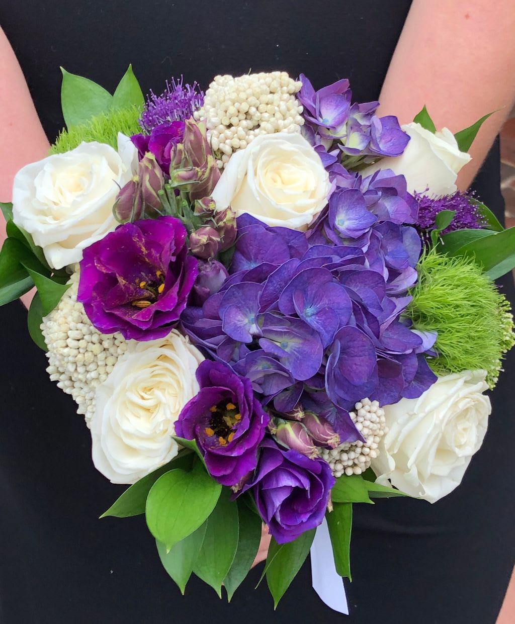 Purple Passion Handheld Bouquet *unavailable April 29th - May 12th* - Purple hydrangea, purple lisanthus, white roses, riceflower and green trick round out this purple bouquet.  *Photo features the deluxe version of this handheld* Tax free, same day hand delivery. 