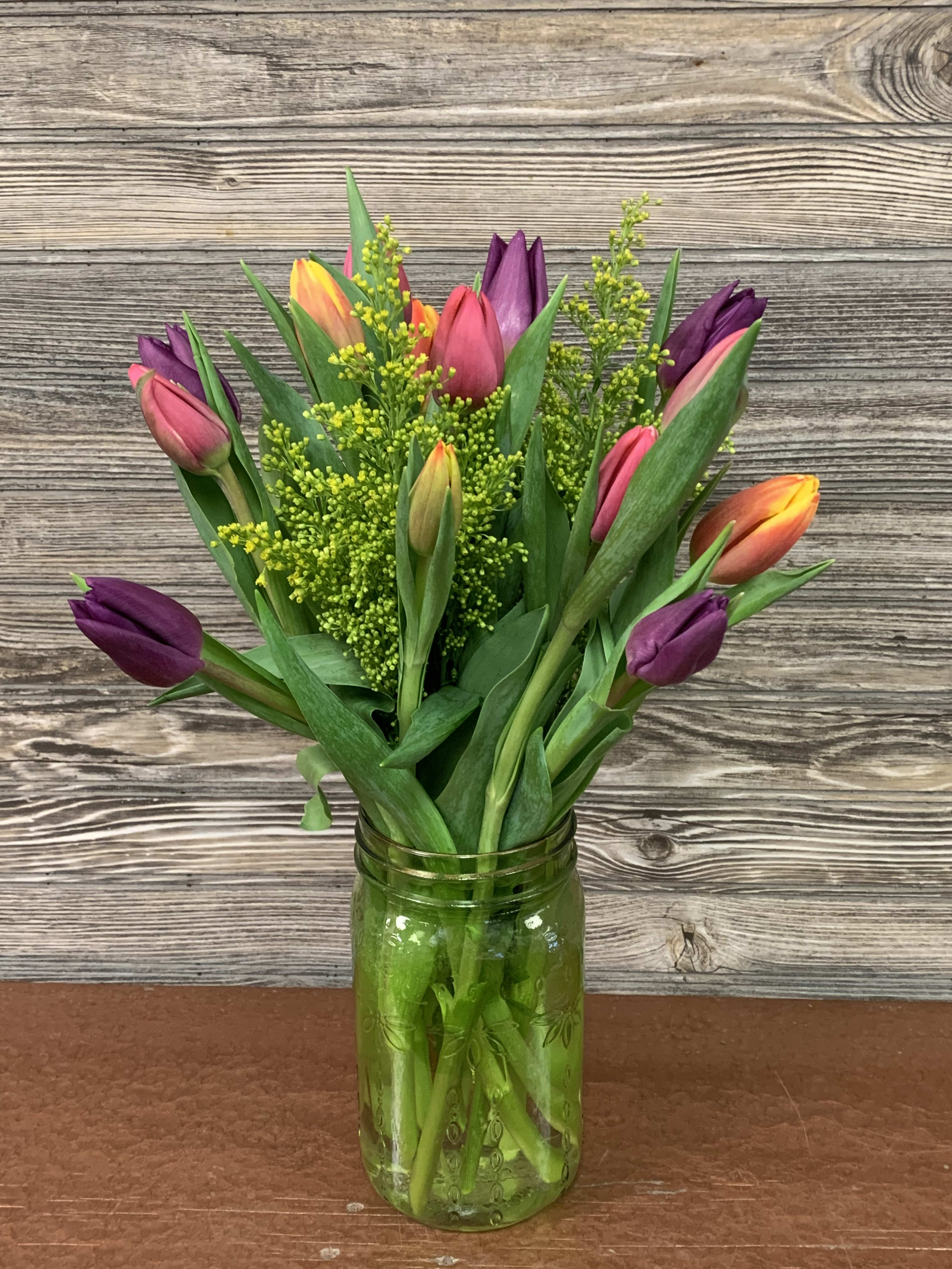 Tulip Mason Jar  - Standard 15 mixed regular and double tulips in a spring-colored mason jar accented with filler and a touch of greenery.  