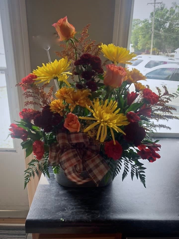 Autumn Smile Bouquet Autumn Smile Bouquet - A variety of fall colored flowers arranged in a bucket.