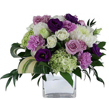 charming bouquet  - This charming bouquet has an English garden feel! Purple and cream roses and carnations complemented with green mini hydrangea and commercial mums!