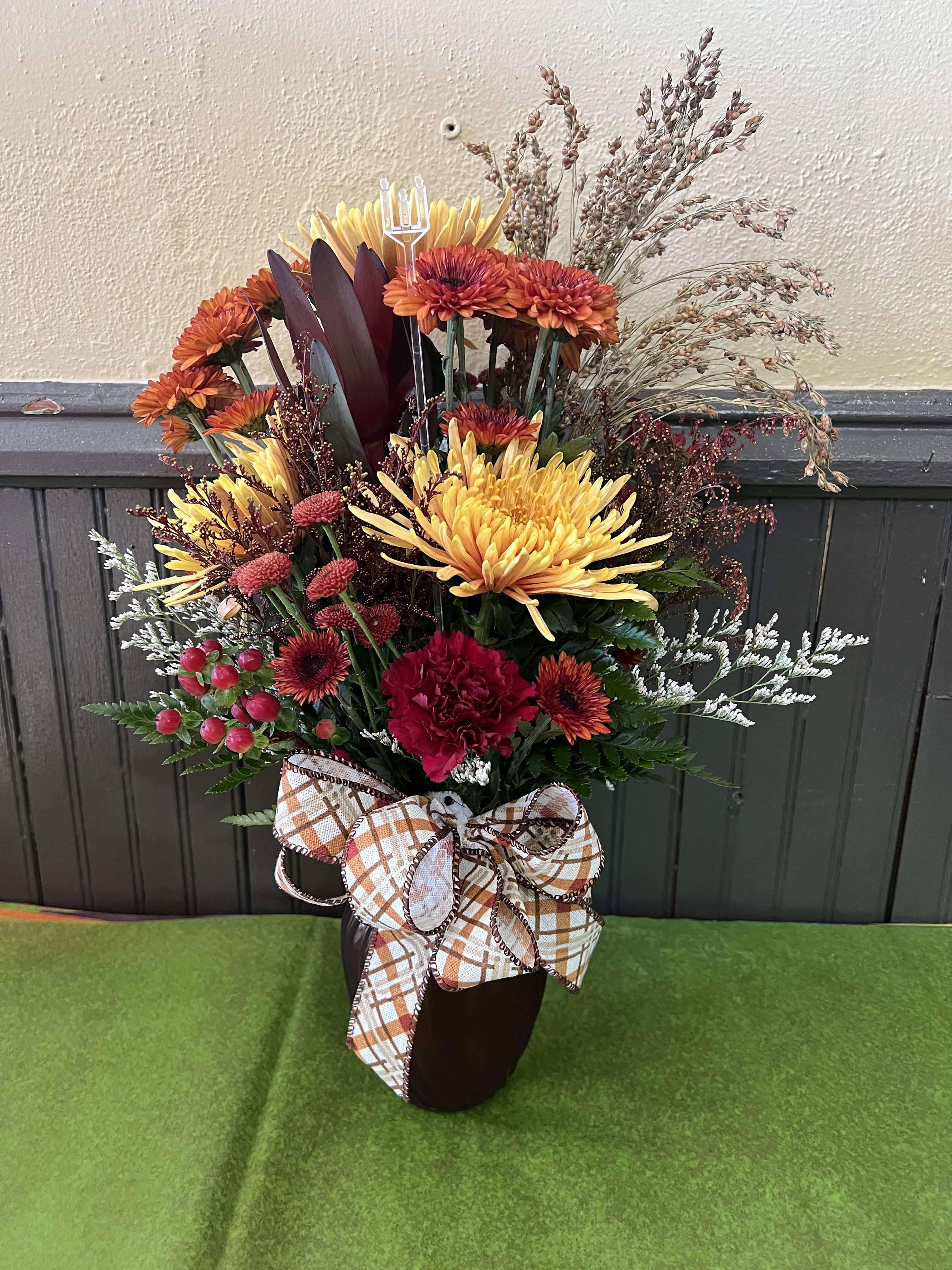 Breathtaking Fall Bouquet Breathtaking Fall Bouquet - A mixture of Fall flowers beautifully arranged in a Fall colored vase