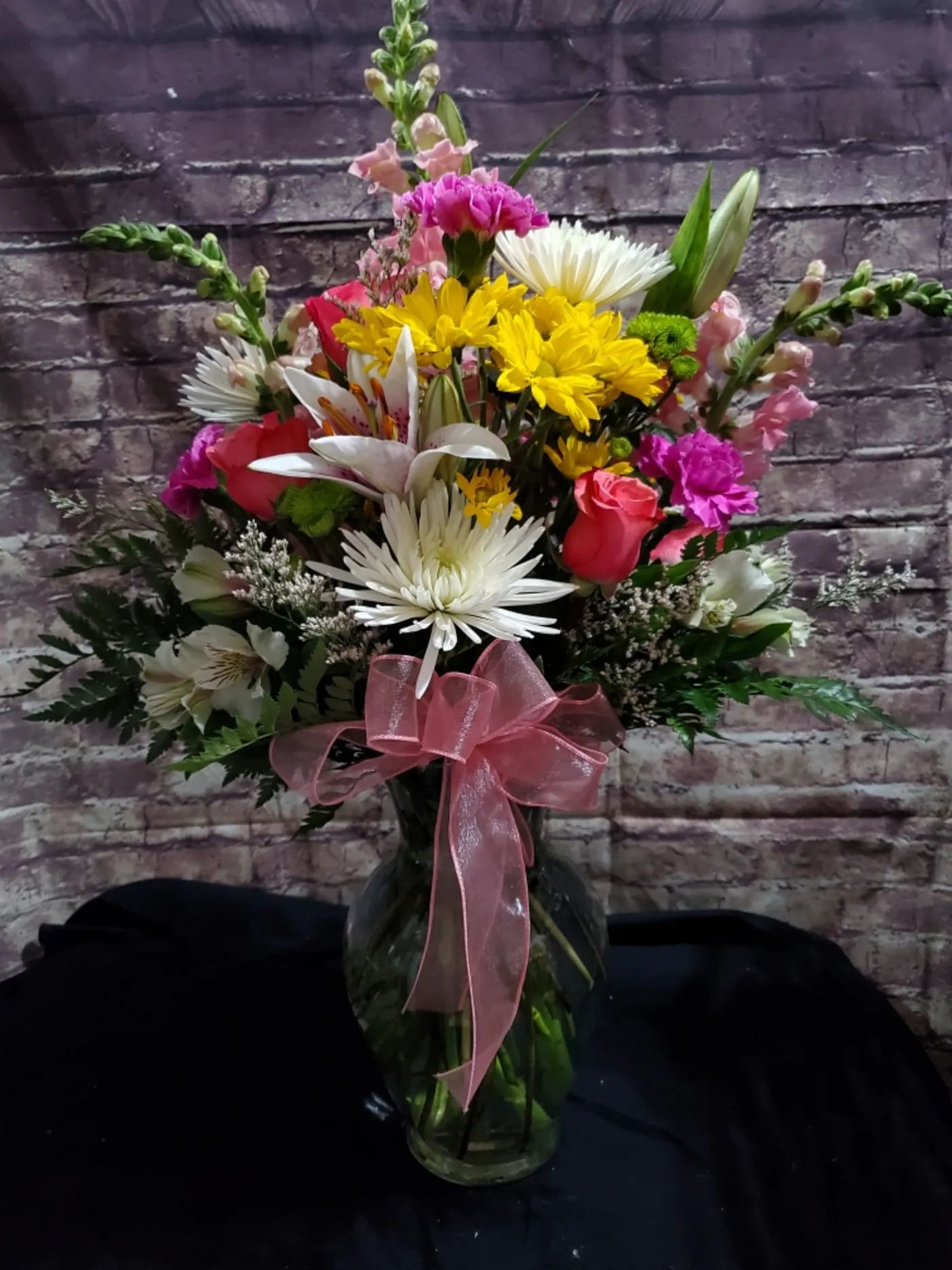 Pastel Posy Bouquet Pastel Posy Bouquet - An arrangement of Pink and Purple mixed with Yellow and White creating the perfect bright fresh arrangement