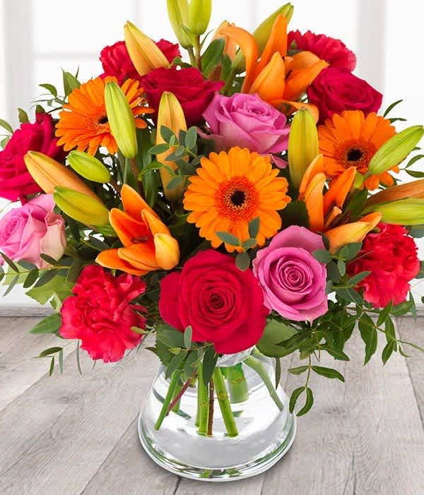 Gerberas,roses,lilies,eucalyptus  - Beautiful and vibrant colors to show your love to your loved one. 