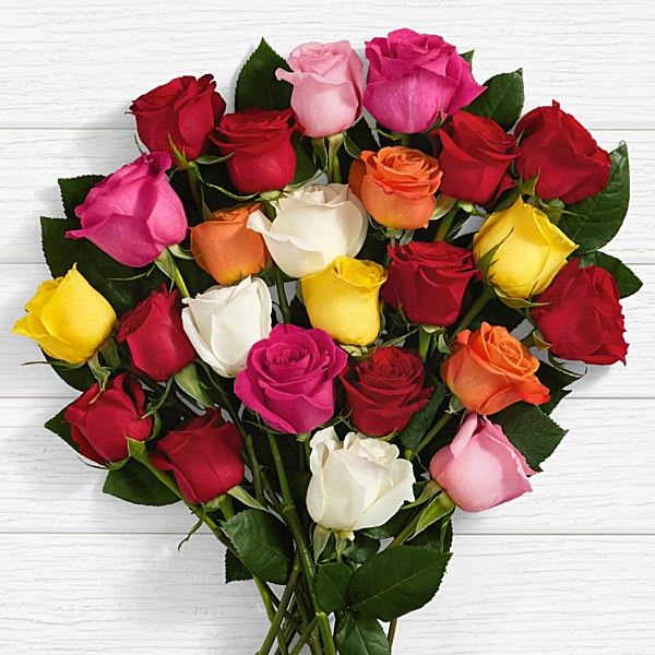 2 Dozen Mixed Roses - Flatter that special someone with an amazing floral arrangement of mixed roses.  Exquisitely arranged, they are sure to put a smile on their face.  Comes in a clear vase.