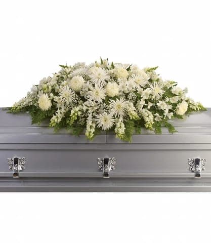ENDURING LIGHT CASKET SPRAY - The purity of this all-white casket spray creates an aura of serenity and peace - a beautifully memorable final farewell to a lost loved one.  Approximately 54 W x 23 H