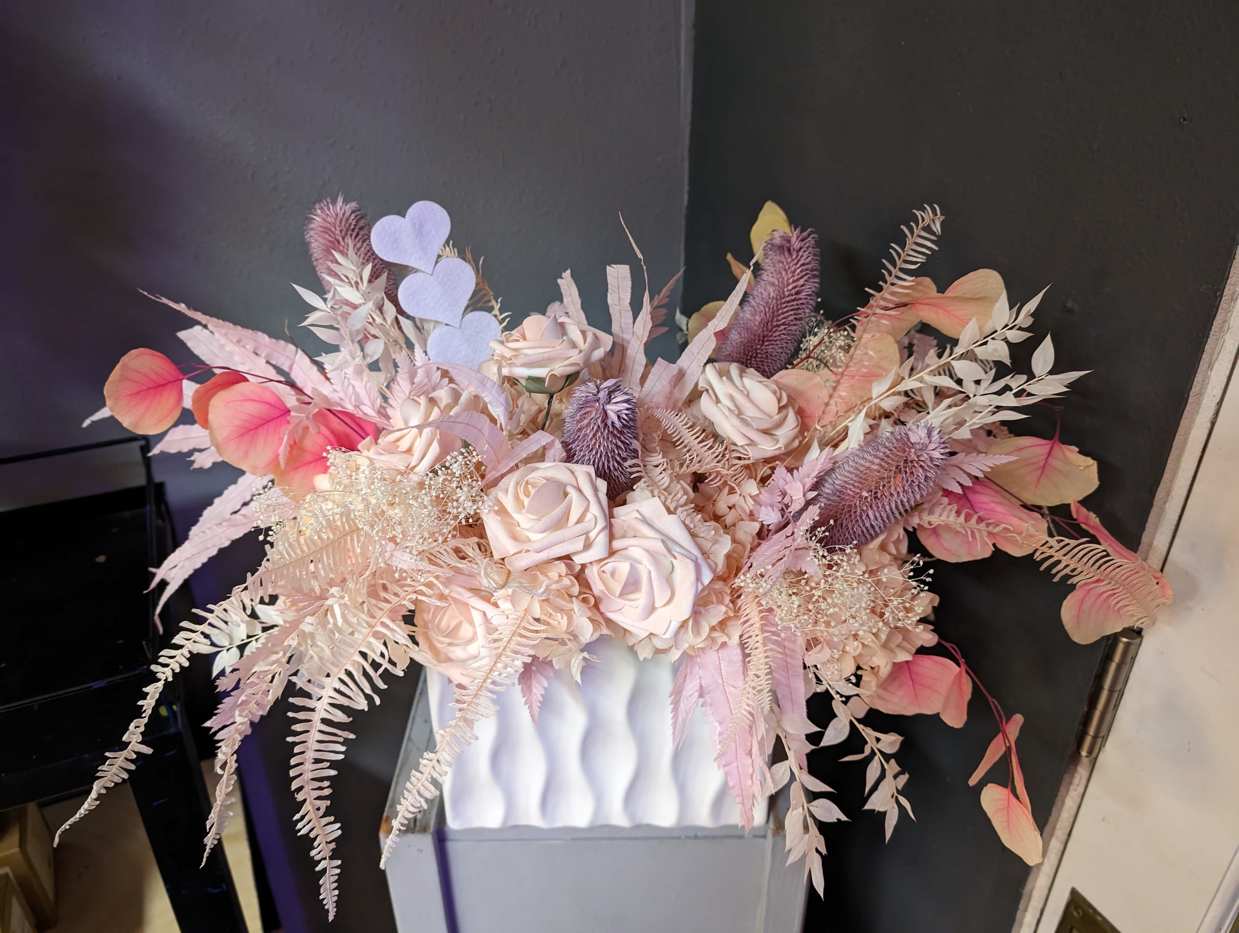 Dried Floral Arrangement - A unique one-of-a-kind dried pink floral arrangement. All elements are dried and will not need any water so they will be very long lasting. A fun piece to add a beautiful and whimsical touch to any space.