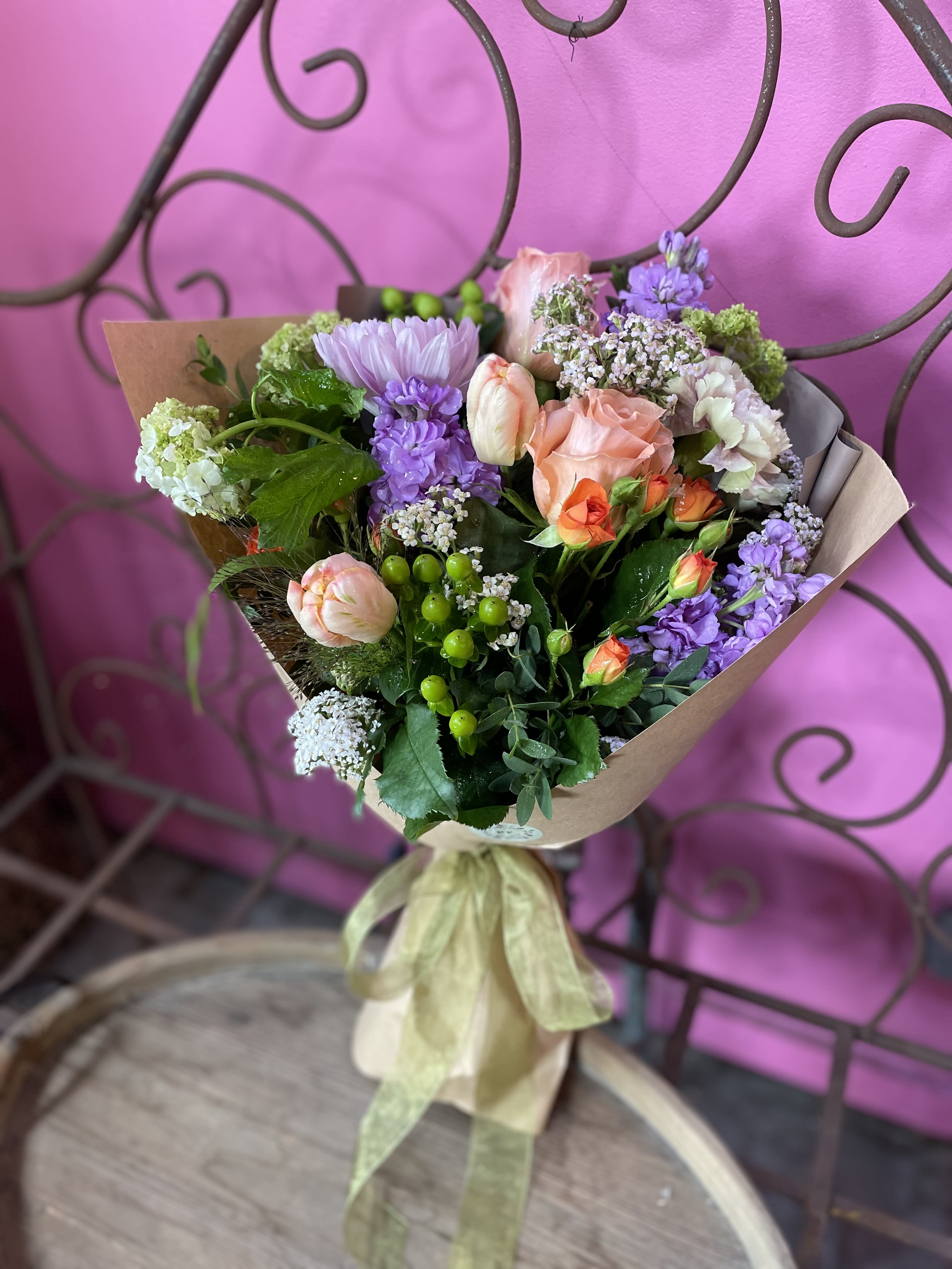 Florist Favorites Bouquet  - Leave it to the professionals at Palisades Flowers to craft a fresh and beautiful handtied bouquet skillfully wrapped in kraft paper. Perfect for those empty vases at home, or as an easy gift to hand deliver for any occasion!  Bouquet flowers depend on seasonal availability, and will match an overall theme of cheerful and bright.   **NOTE** Since wrapped bouquets ARE NOT in water, please be sure to ensure recipients will be home for delivery so the flowers don't sit out of water too long to stay extra fresh and bouncy! 