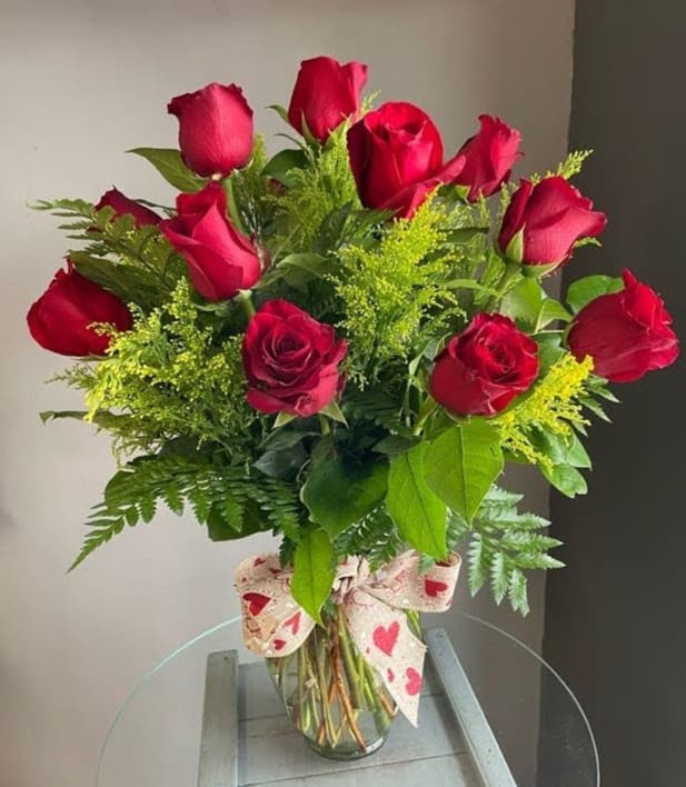 1 Dozen Long Stem Red Roses - Long stem red roses in a vase with greens and filler. This classic arrangement will convey romance, desire and always makes someone feel loved.     ***PLEASE NOTE*** 1) Our storefront will be open. 2) BLOOMSNAPS OR TIMED DELIVERY ARE NOT AVAILABLE THE WEEK OF 5/10-5/12 3) Please be flexible. Based on quality and/or availability, Substitutions of equal or greater value may be made at the designer’s discretion (including flowers, greens, filler, vase and hard goods) without notice