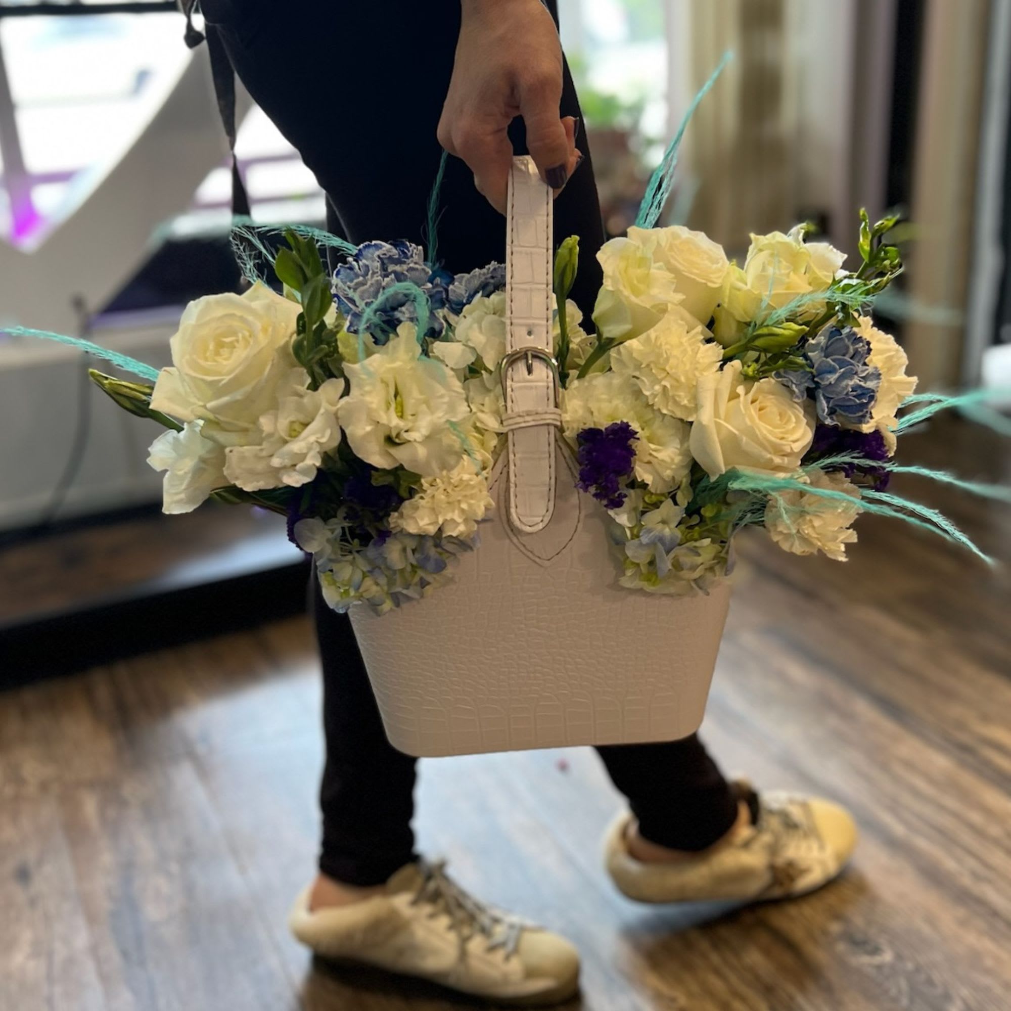 Flower Arrangement in a bag - Simply tell us your favorite color scheme for flowers and we will design a stunning floral arrangemet just for you.