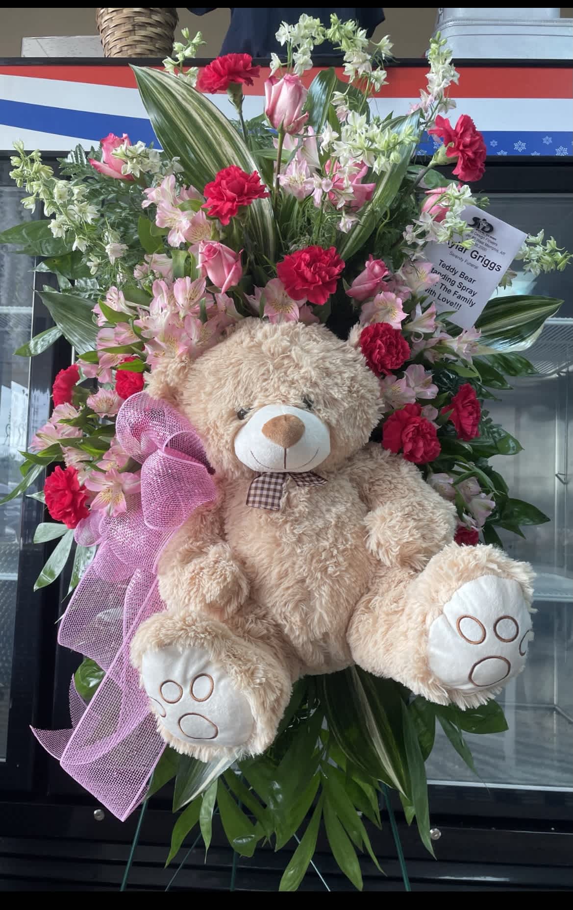 Teddy Bear Standing Spray - Custom-designed standing spray on a 54-inch easel with a teddy bear and flower designed to bring a little joy to a loved one during a time of sorrow.
