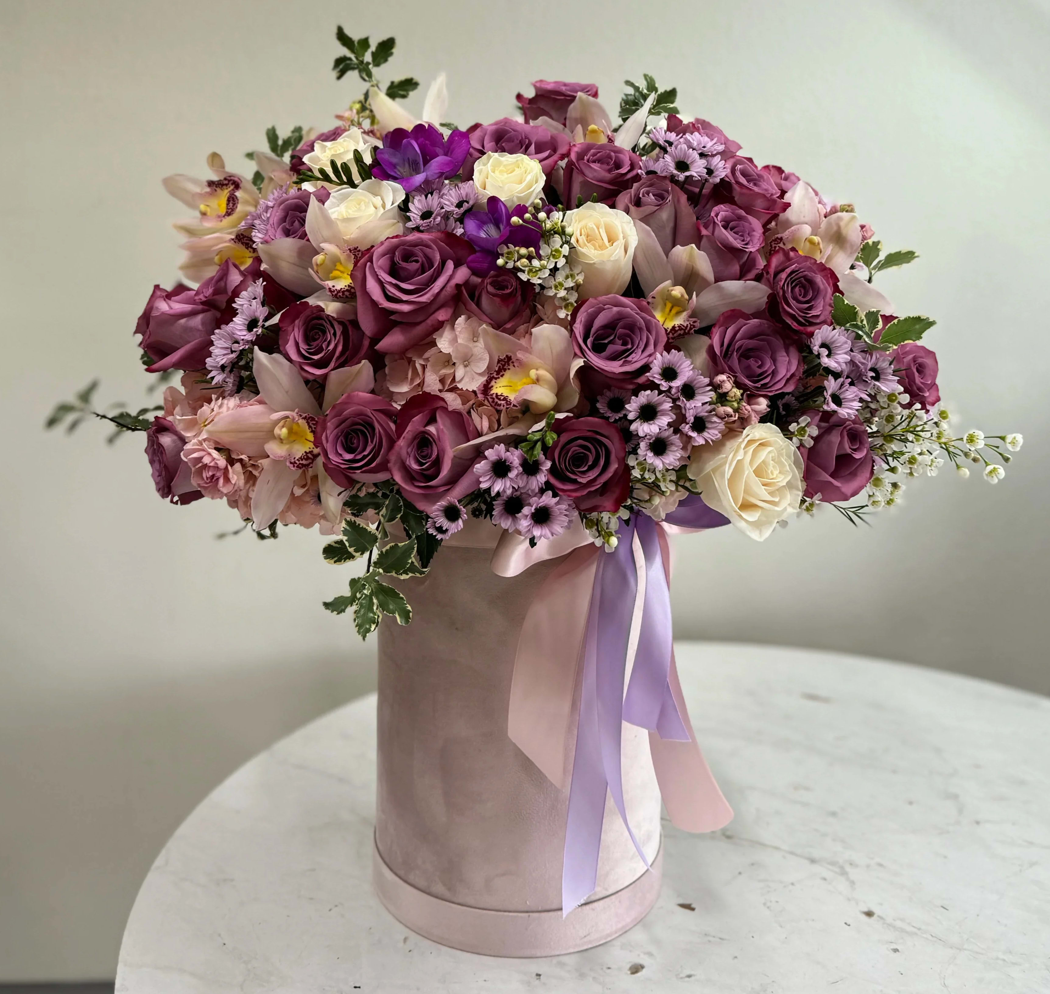 Mixed Pastel Arrangement - Roses, orchids and mixed flowers arranged in a box. (any color of flowers and box of choice)
