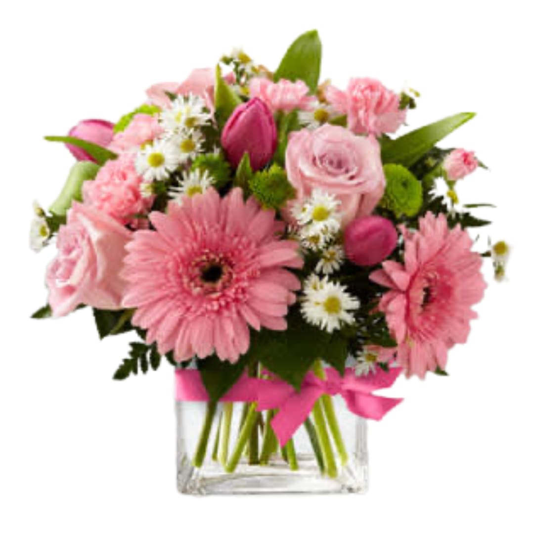 The FTD® Blooming Visions™ Bouquet by Better Homes and Gardens - B29-4805E  FTD® proudly presents the Better Homes and Gardens® Blooming Vision™ Bouquet. Offer them a bouquet blooming with a &quot;fresh from the garden&quot; appeal. Pink roses, hot pink tulips, pink mini carnations and pink gerbera daisies are accented with white Monte Casino asters and lush greens. Gorgeously arranged in a clear glass cube vase accented with a pink satin ribbon, this bouquet is a soft and graceful way to send your warmest sentiments.