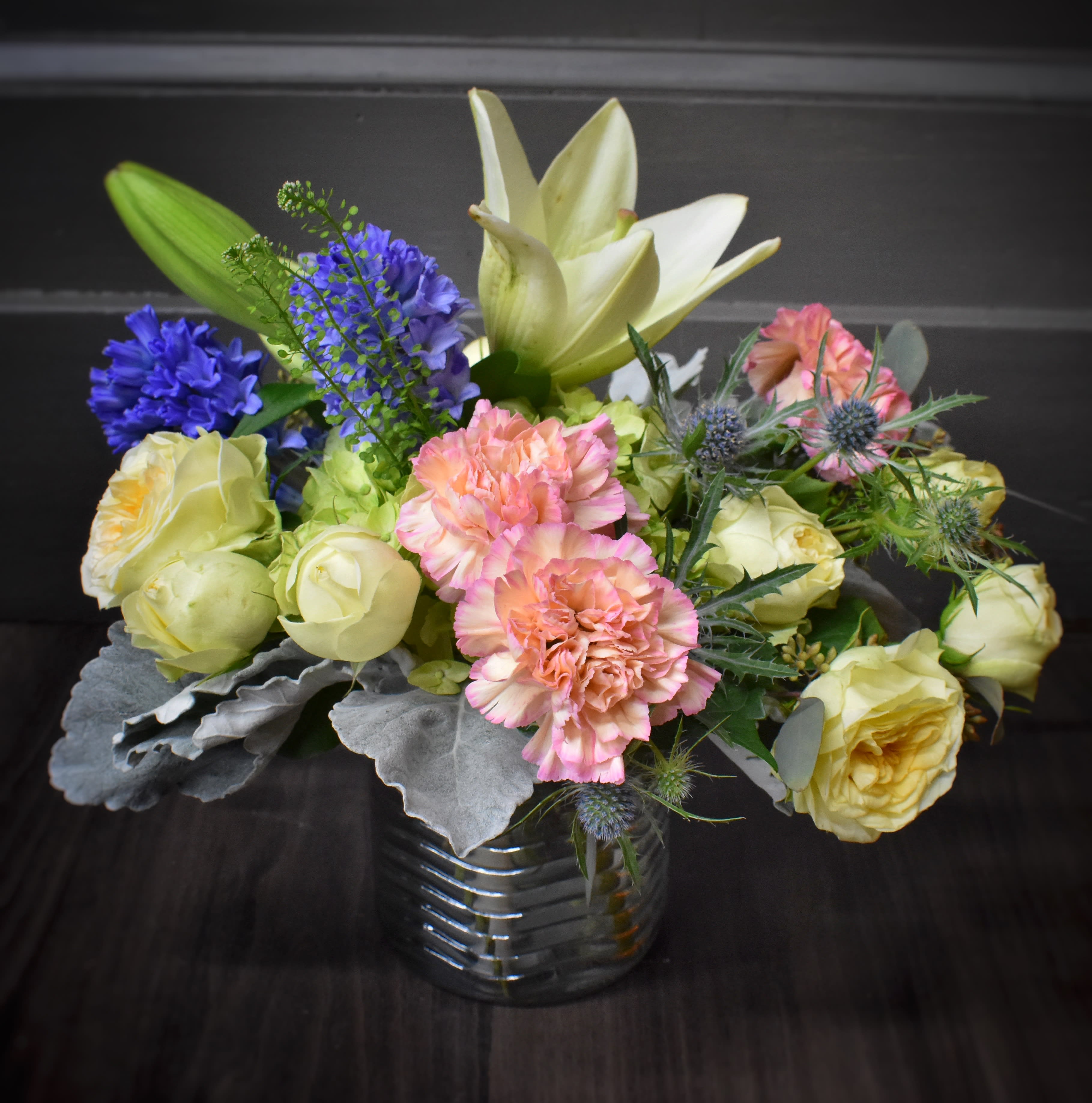 Colors of Monet  - Just like a piece of art, this vase of soft colored spring flowers will brighten anyones day! Spray roses, hyacinth, carnations and more.