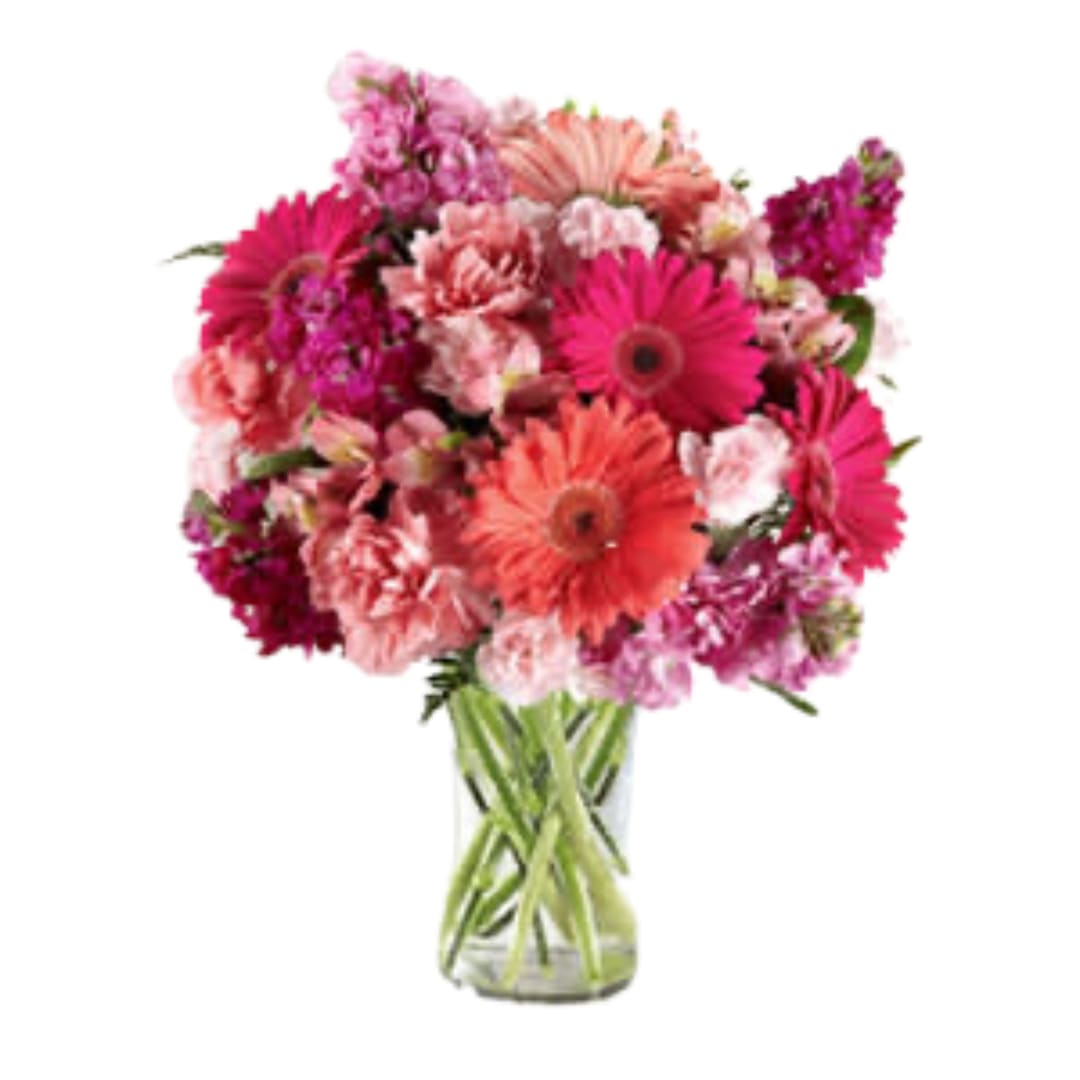 The FTD® Blushing Beauty™ Bouquet - Melt their heart with sun-crushed blooms blossoming with an array of color and light your recipient won't soon forget. Coral and hot pink gerbera daisies captivate the eye surrounded by pink Peruvian Lilies, pink and hot pink gilly flower, pale pink carnations and mini carnations, and lush greens situated beautifully in a modern clear glass vase. A simply wonderful way to send your warmest wishes in honor of their birthday, as a thank you or get well gift, or to shower them with your love and affection! GOOD bouquet includes 13 stems. Approx. 13&quot;H x 10&quot;W. BETTER bouquet includes 17 stems. Approx. 14&quot;H x 11&quot;W. BEST bouquet includes 21 stems. Approx. 15&quot;H x 12&quot;W.