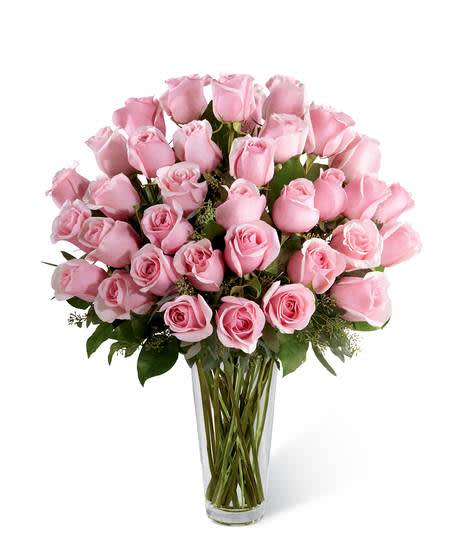 Pink Rose Bouquet Pink Rose Bouquet - Picture-perfect soft pink roses make a beautiful gift for the lovely lady in your life. Wife, mother, daughter or sweetheart, she's sure to cherish this bouquet of pastel pink roses accented with seeded eucalyptus and arranged in a clear glass vase.