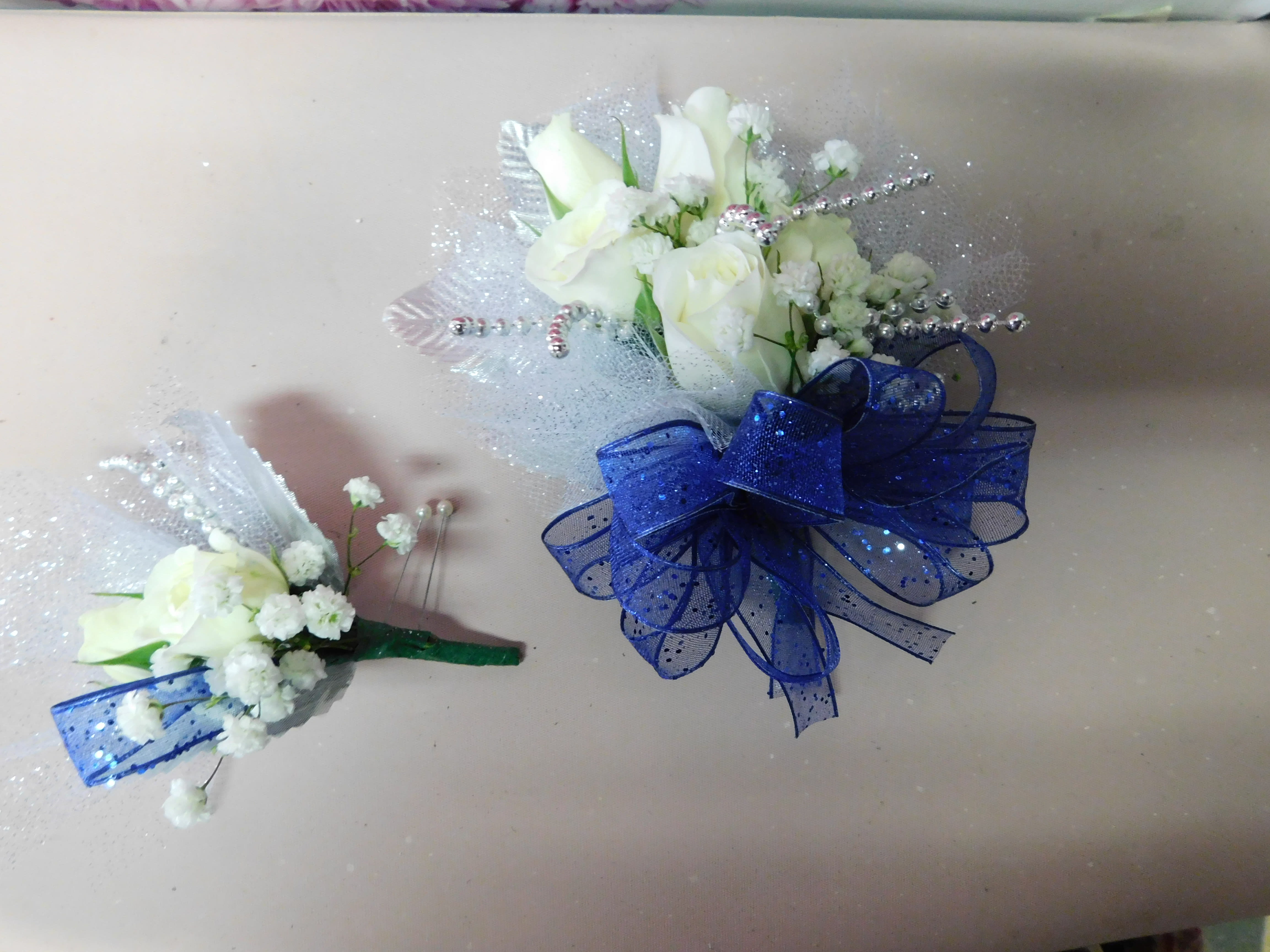 Corsage & Boutonnieres Corsage & Boutonnieres - Custom made corsages for weddings and prom. Colors and styles can be modified to color coordinate with any event.