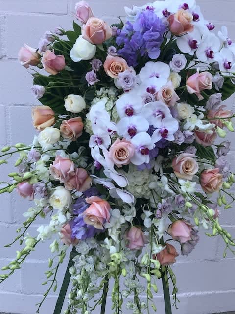 Cherished Love  - Say good bye to that special someone with an elegant standing spray of  orchids, roses and hydrangeas. 