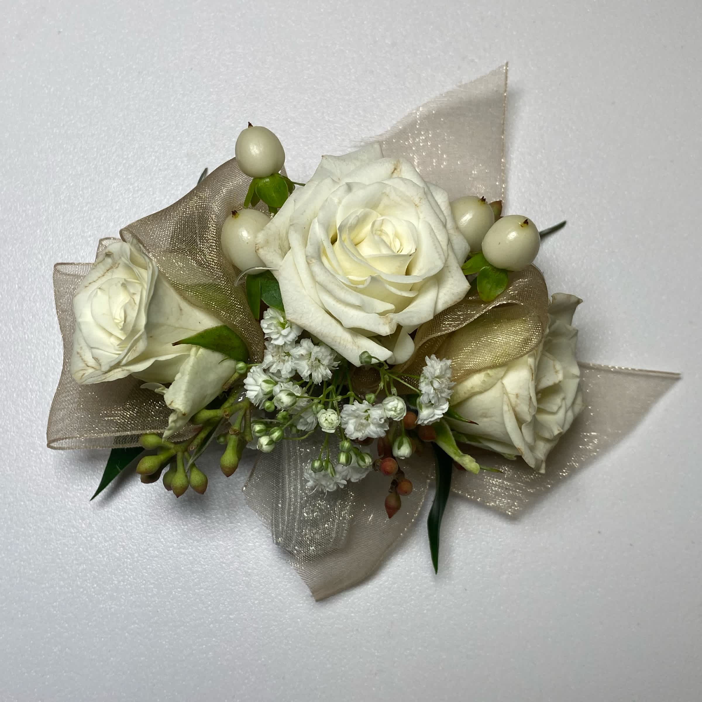 Gold/ White Rose Wrist Corsage - Prom/Wedding - This White Rose Corsage Includes an Adult Size Elastic Wristband, Gold Chiffon Ribbon, White Spray Roses, Hypericum Berries, Gentle Greenery and Seeded Eucalyptus. Or as Similar as Possible.