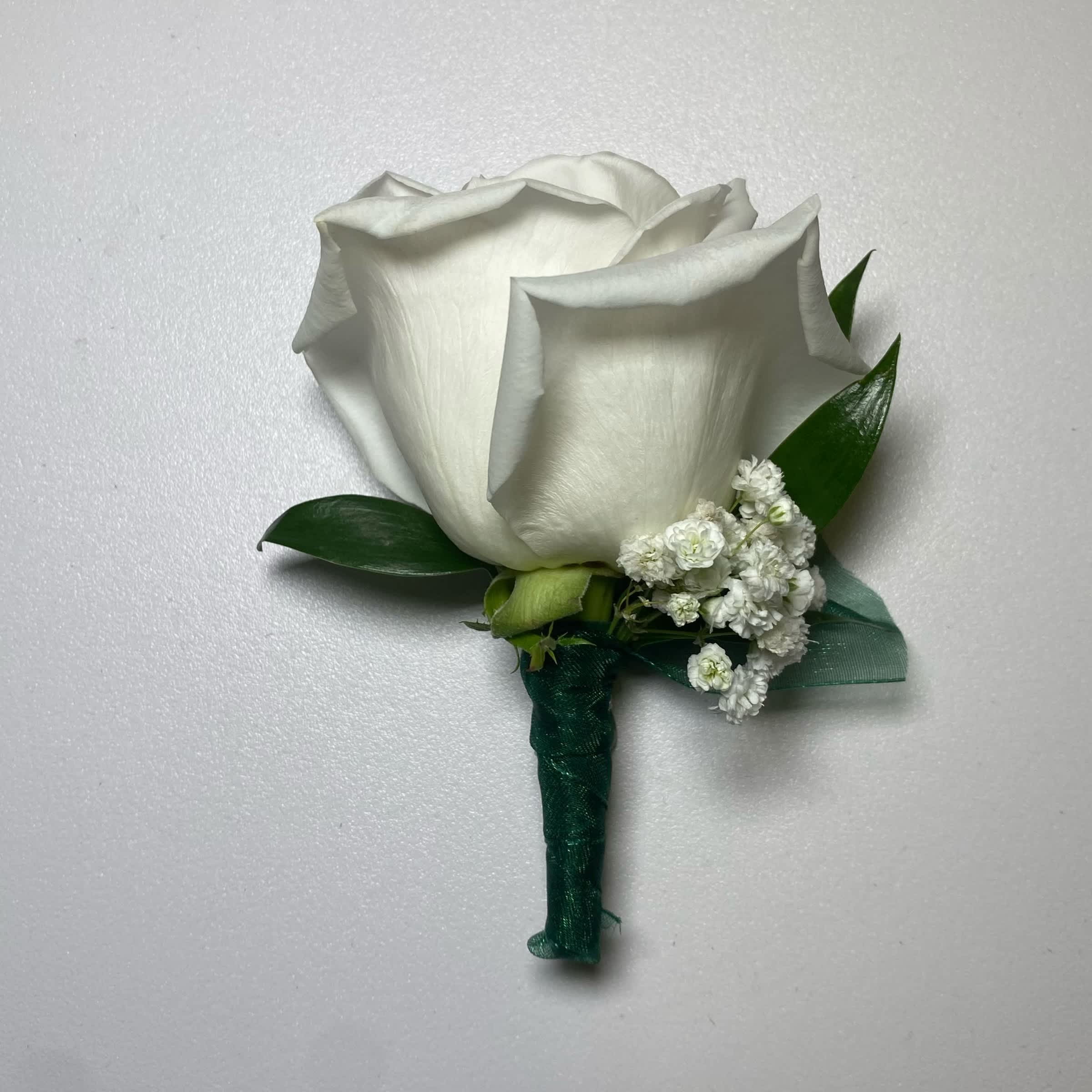 Hunter Green/ White Rose Boutonniere - This White Rose Boutonniere Includes, Hunter Green Chiffon Ribbon, White Rose, Babies Breath, and Gentle Greenery. Or as Similar as Possible.