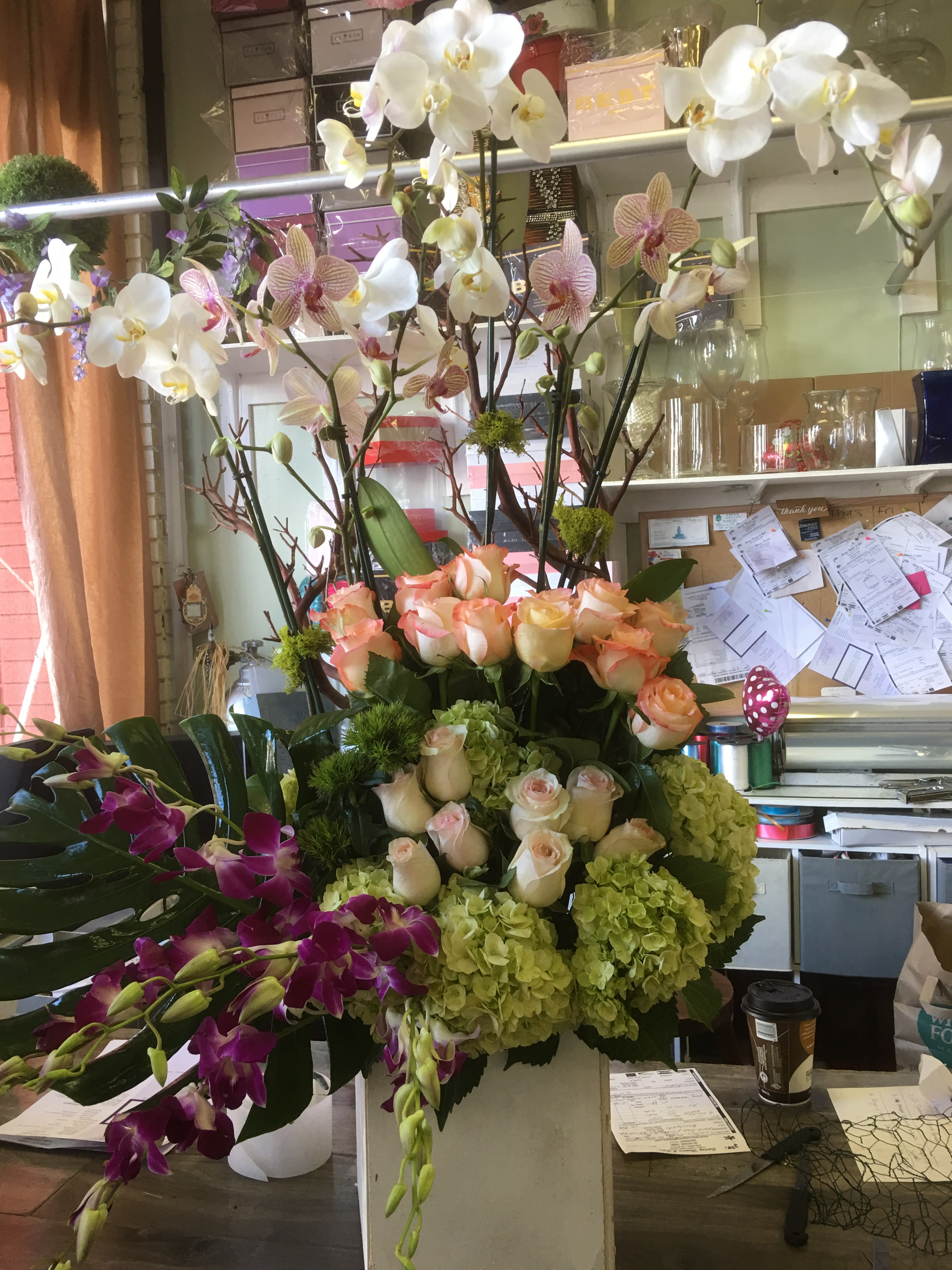 Rosey Orchid Elegance - roses, orchids, hydrangeas in a tall box arrangement with wood branches
