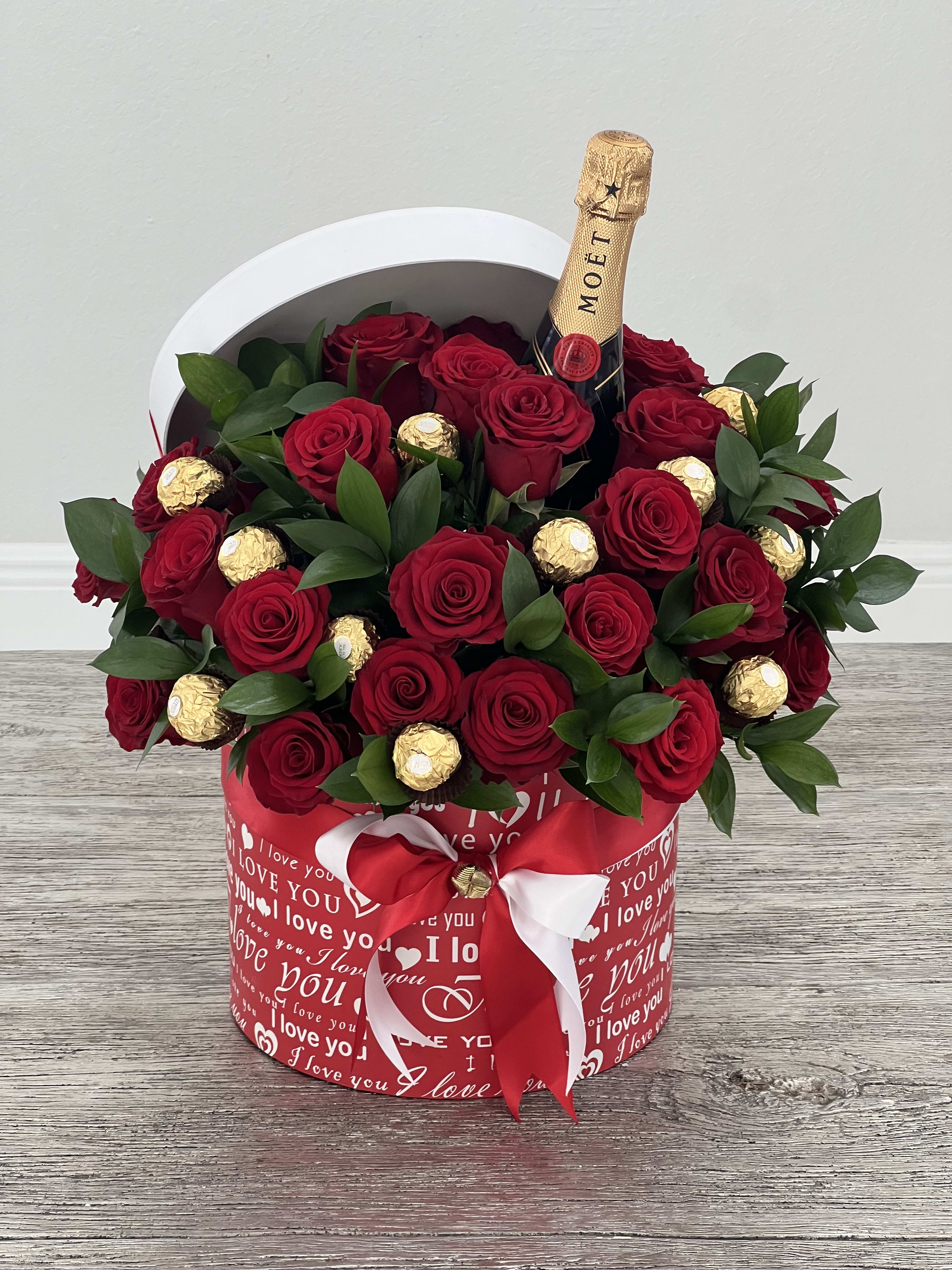 Infinite Love - Arrangement of two dozen fresh roses, sophisticated greenery, Ferrero Rocher chocolates and small bottle of Moët champagne 