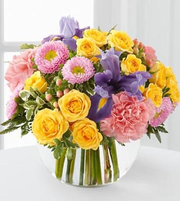 The New Dream Bouquet The New Dream Bouquet - The New Dream Bouquet is a bright and cheerful way to send your warmest sentiments. Sweet yellow spray roses, pink carnations, asters and blue iris arrive in a glass bubble bowl vase to create a sunny display bursting with beauty and full of happy wishes for the days ahead. (Vase/Basket style may vary) Item # D4-4181