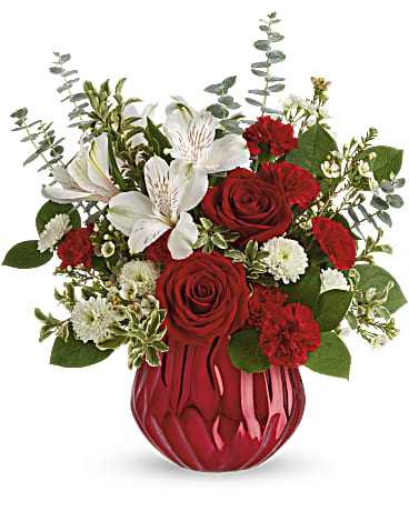 Teleflora's Heart Shine Bouquet Teleflora's Heart Shine Bouquet - Send a truly enchanting gift this Valentine's Day with this delicate red rose bouquet, presented in a swirling ceramic vase with sparkling metallic finish. This lovely arrangement features red roses, white alstroemeria, miniature red carnations, white button spray chrysanthemums, white wasflower, spiral eucalyptus, pitta negra and lemon leaf. Delivered in Teleflora's Enchanted Gem cylinder.