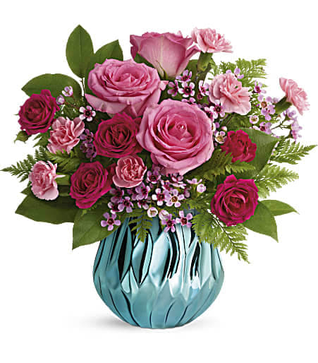 Teleflora's Gem Of My Heart Bouquet Teleflora's Gem Of My Heart Bouquet - Make mom feel like the gem that she is with this magnificent mirrored ceramic vase, fabulously faceted to catch in the light! Bursting with lush pink roses, it's a sparkling reminder of your love.