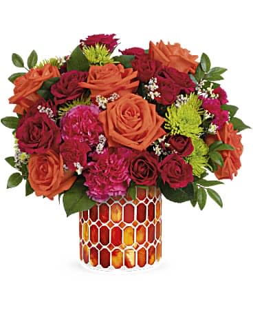 Teleflora's Citrus Dream Bouquet Teleflora's Citrus Dream Bouquet - A dreamy dose of happiness, this beautiful orange and pink bouquet looks its best in this stunning stained glass mosaic vase. Orange roses, hot pink carnations, hot pink spray roses, green cushion spray chrysanthemums, white limonium and miniature hot pink carnations are arranged with lemon leaf and huckleberry. Delivered in Teleflora's Autumn Radiance Mosaic vase.